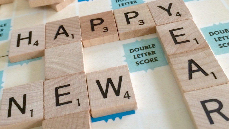 Scrabble board spelling out Happy New Year