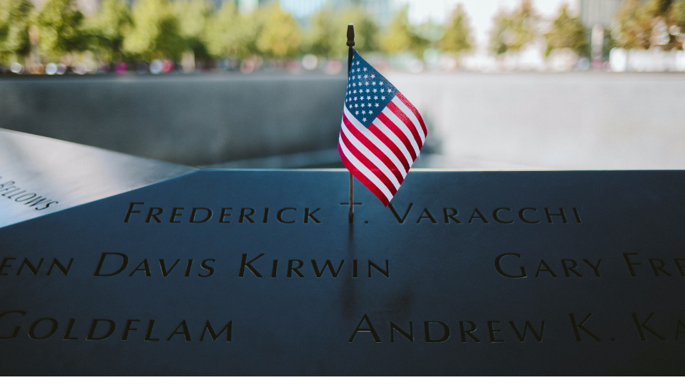 Ground Zero in New York with an American Flag placed in one of the names
