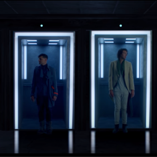 screenshot of for KING AND COUNTRYs new video four people standing in individual fluorescent lit doorways