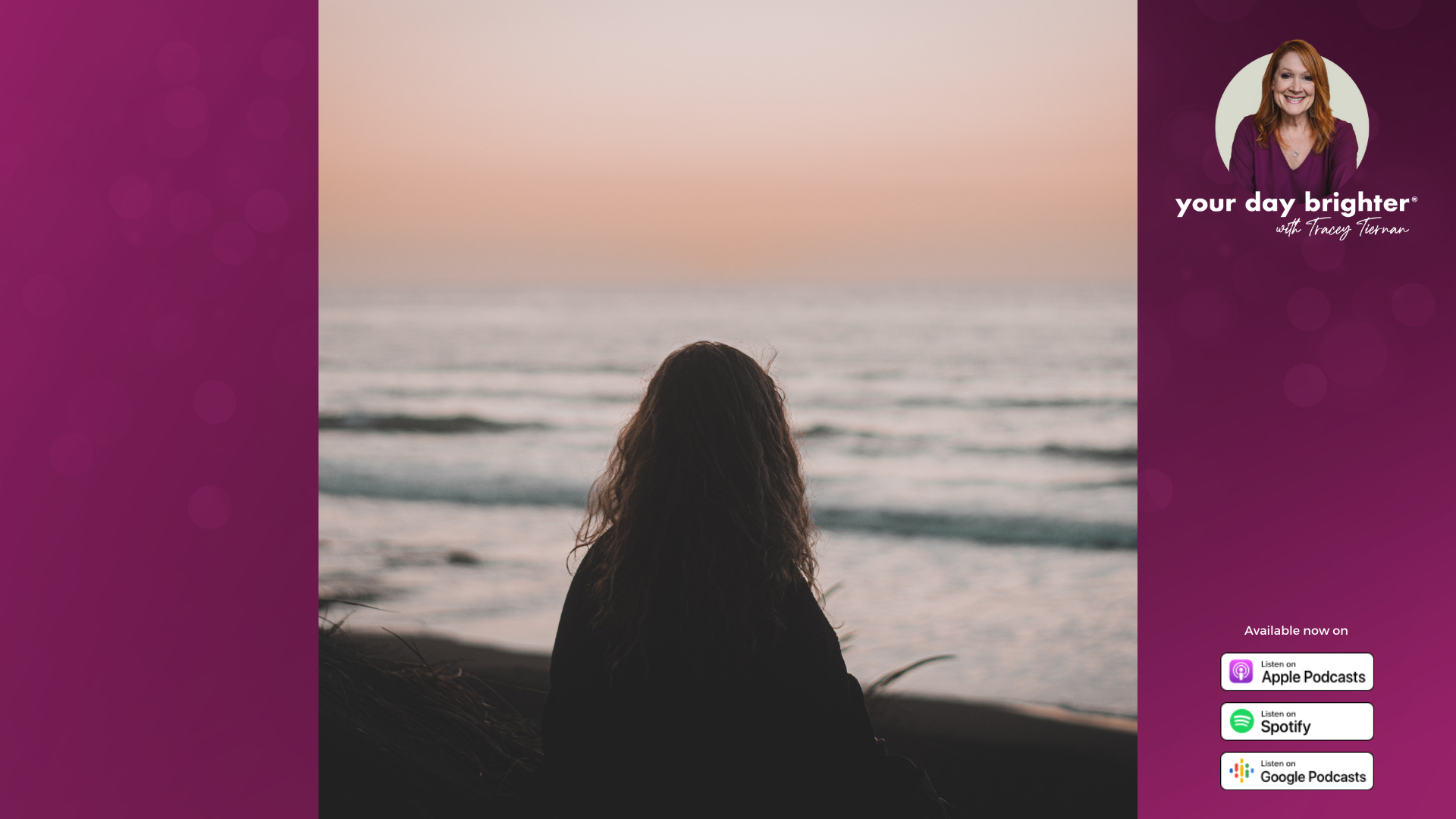 woman with long wavy hair staring out at the ocean as the sunsets