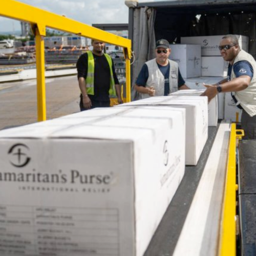 Samaritan's Purse team members unload relief supplies after hurricane