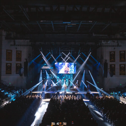 Concert stage lights with a full venue