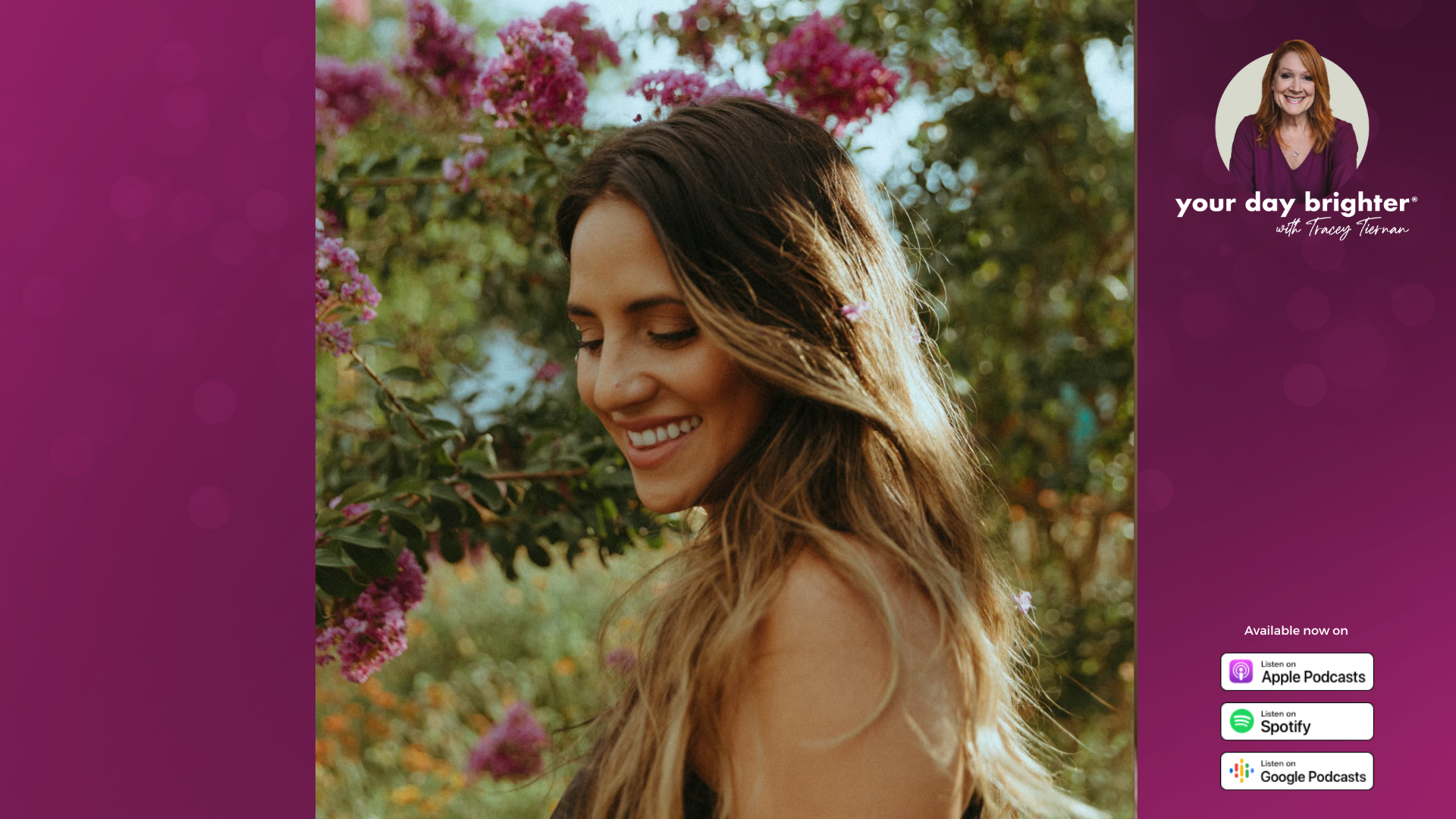 Rachael Lampa smiling in a green field next to a tree with purple flowers budding from it