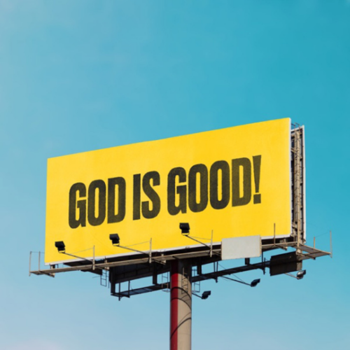 Yellow billboard with words "God is good!"