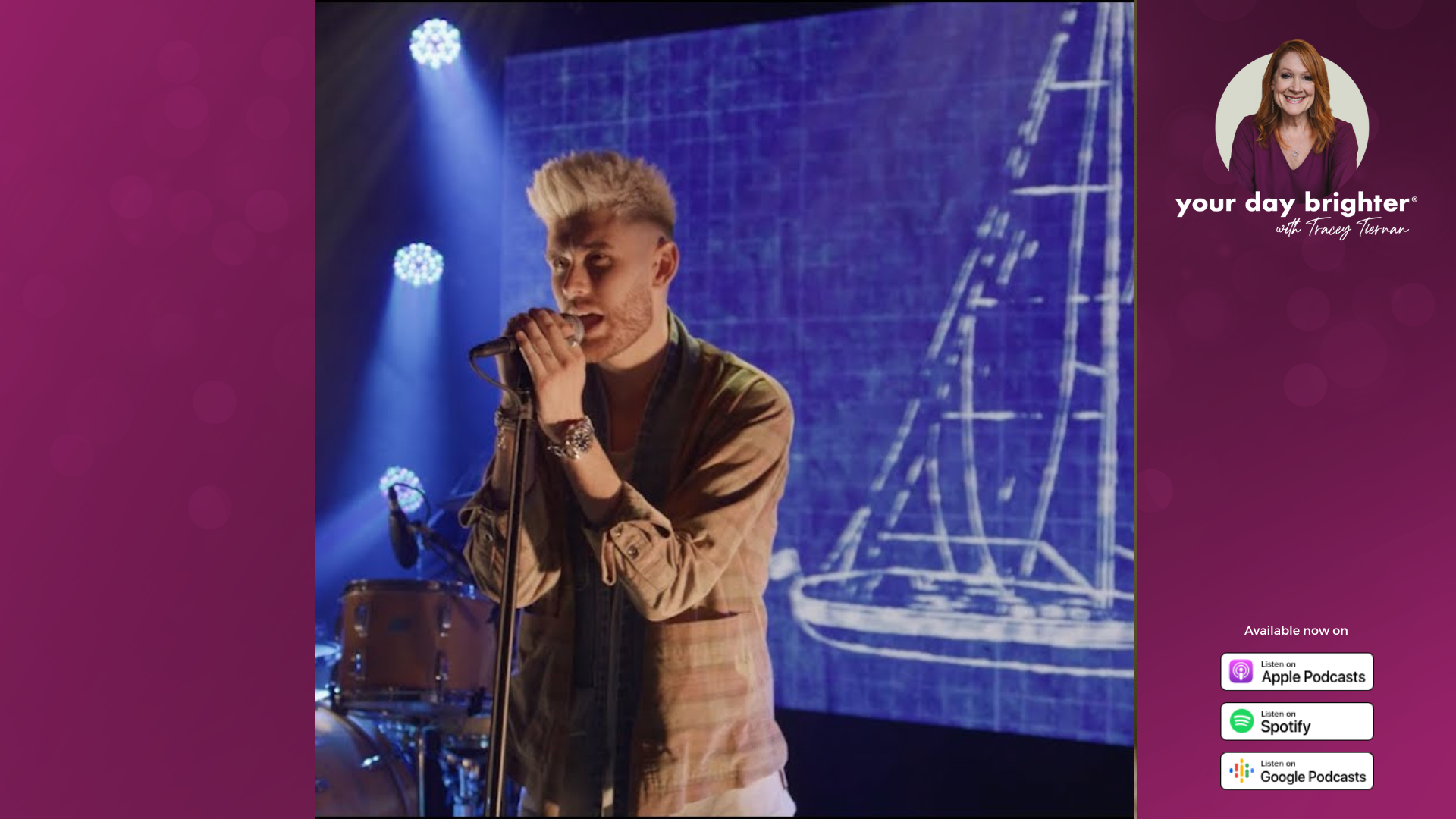 Colton Dixon singing into a microphone with a blueprint of a sailboat on a screen behind him