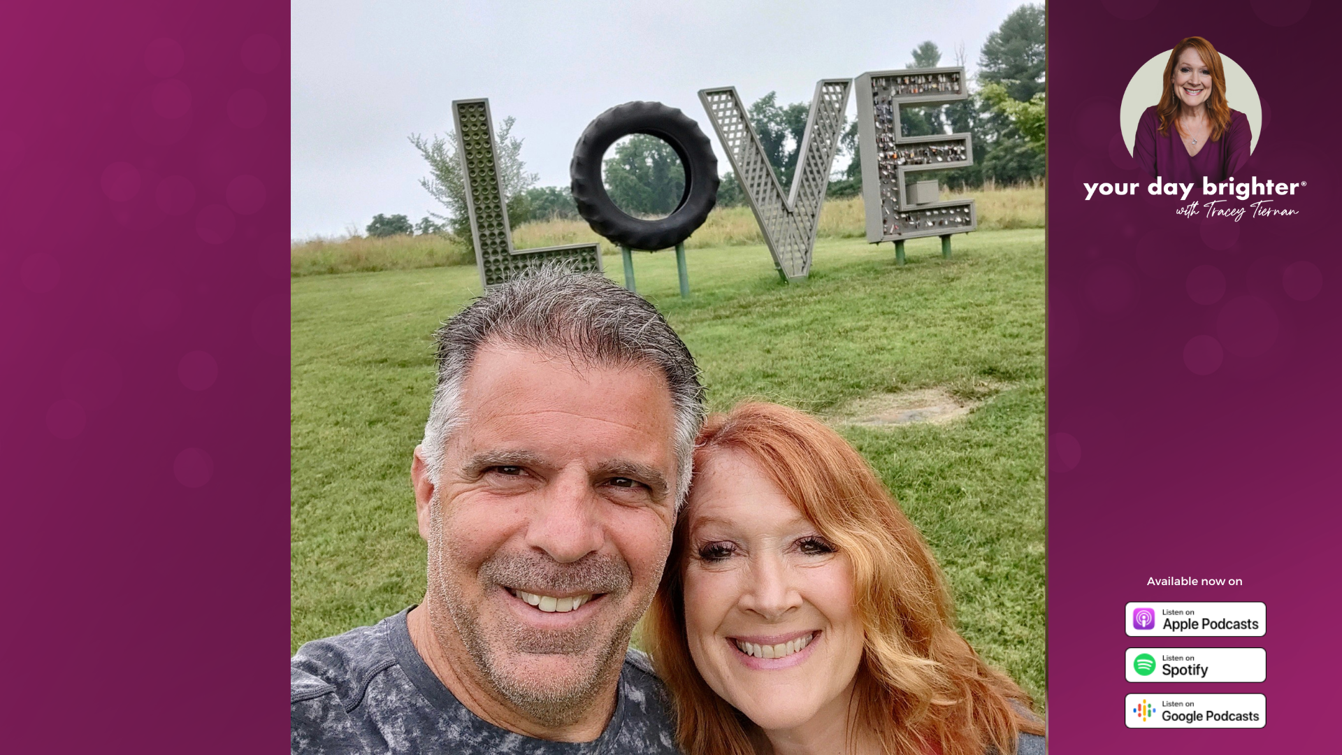 Tracey Tiernan and her husband Gary smiling in front of a sign that spells out LOVE