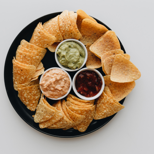 A plate of chips and dip.