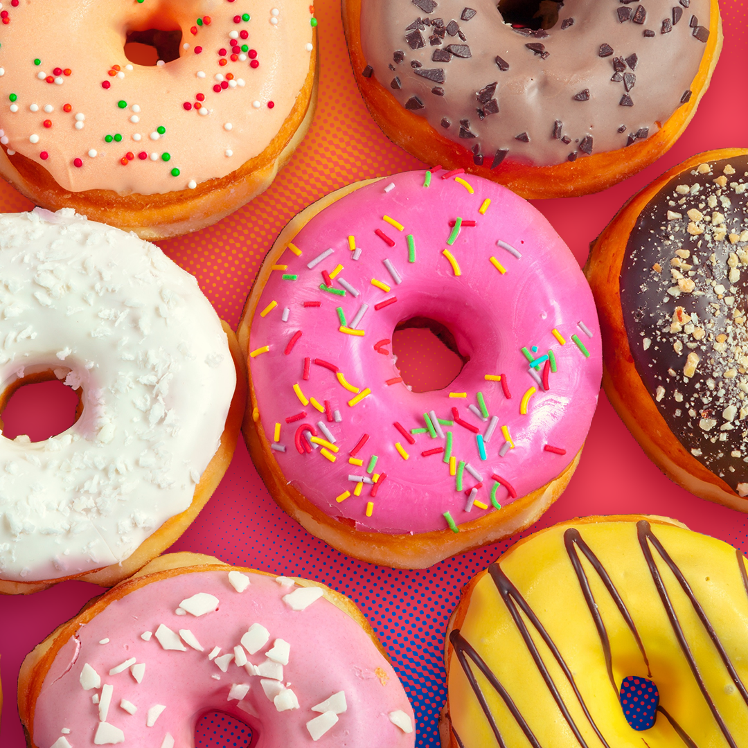 Colorful donuts on an orange background